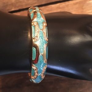 Gold tone, enamel and rhinestone bracelet.